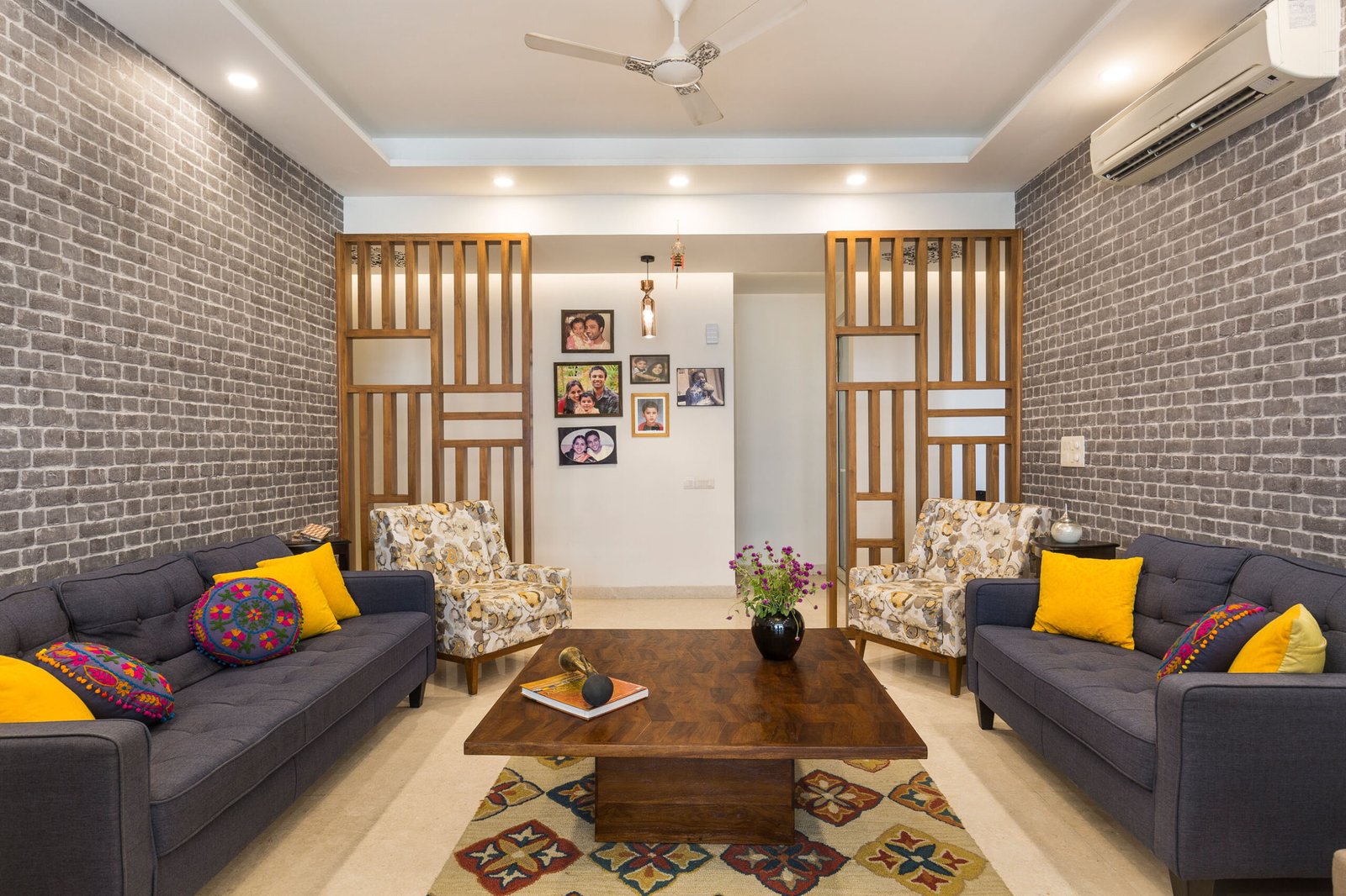 2 BHK Contemporary Flat Design with Earthy Toned Furniture and Dark Wood Flooring