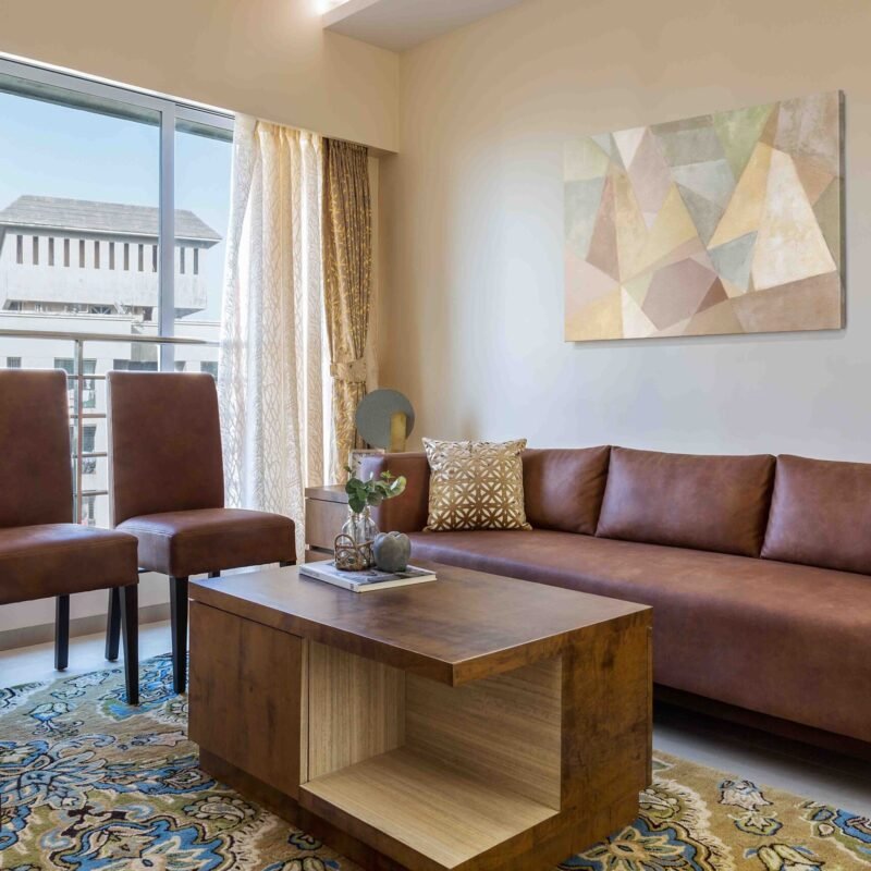 Modern 2 BHK Flat Design with Earthy Tones and L Shape Kitchen