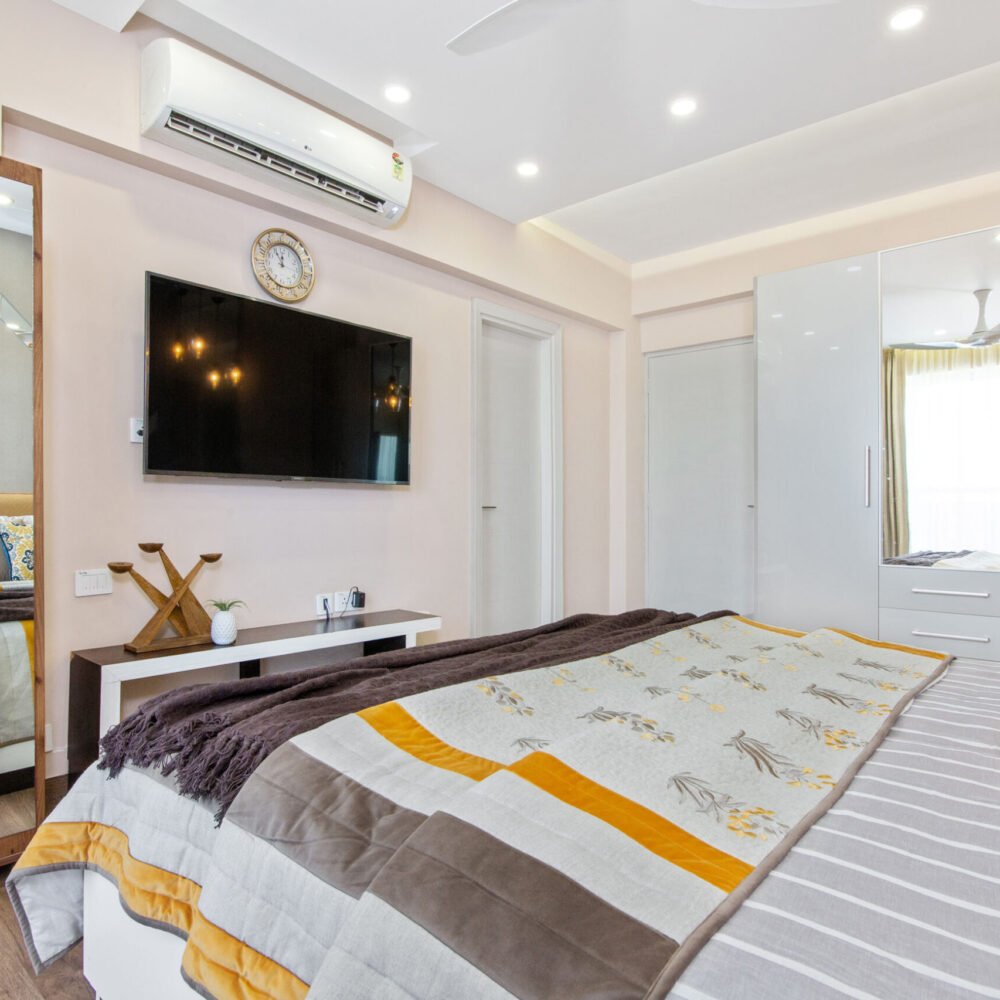 Contemporary 2 BHK Flat Design with Master Bedroom and Guest Bedroom with 4 Door Wardrobe