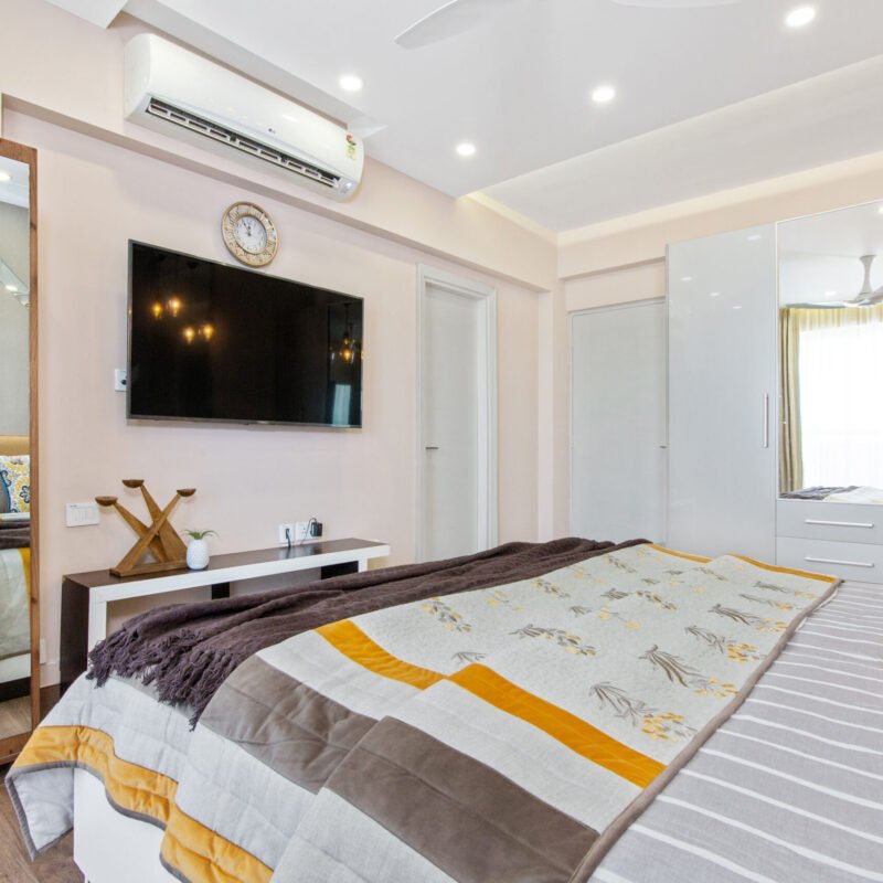 Contemporary 2 BHK Flat Design with Master Bedroom and Guest Bedroom with 4 Door Wardrobe