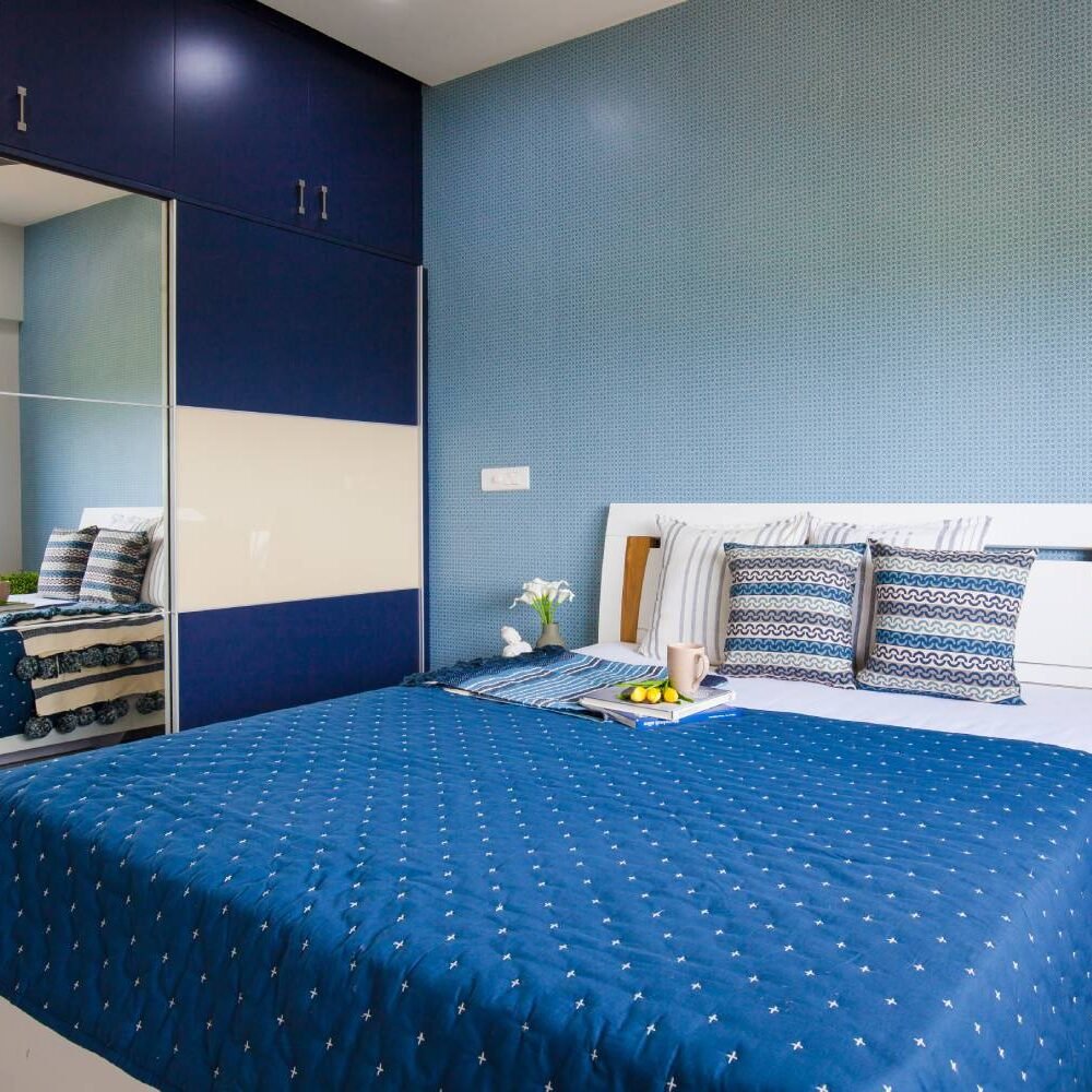 Contemporary 2BHK Flat Design with Geometric Patterns and U-Shaped Kitchen