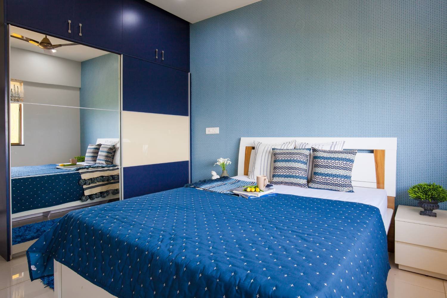 Contemporary 2BHK Flat Design with Geometric Patterns and U-Shaped Kitchen