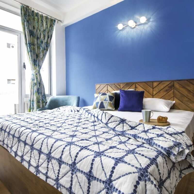 Contemporary 2BHK Flat Design with Cream and Burgundy Sofa