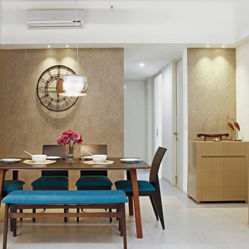 Contemporary 2BHK Flat Design with Bold Cushions and Artistic Wall Frames