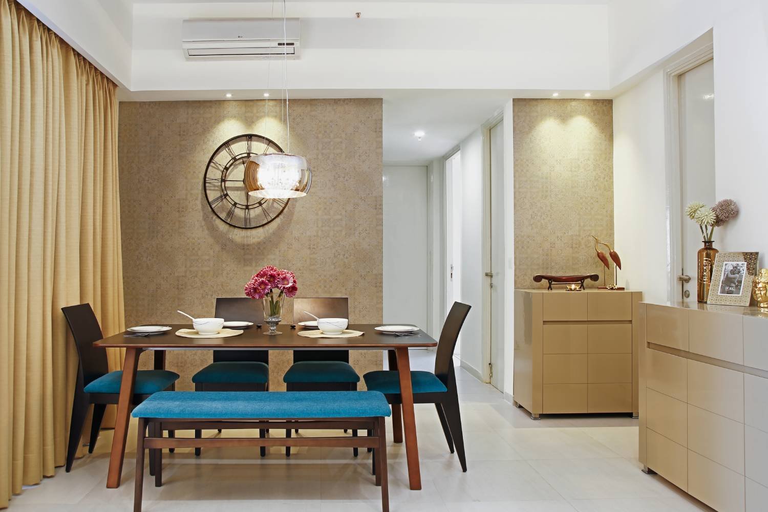 Contemporary 2BHK Flat Design with Bold Cushions and Artistic Wall Frames