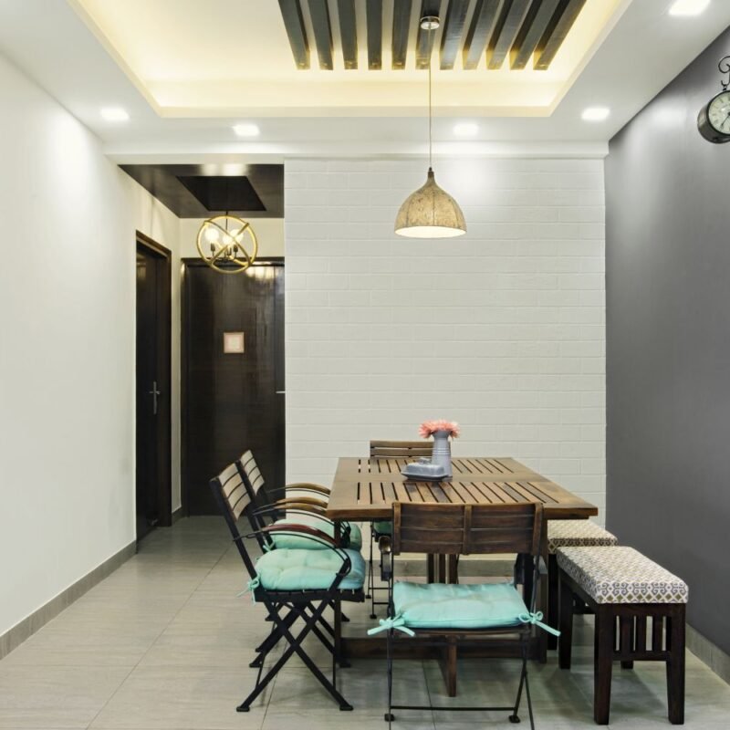 Contemporary 2BHK Flat Design with Inviting Balcony and Pop of Color in Living Room