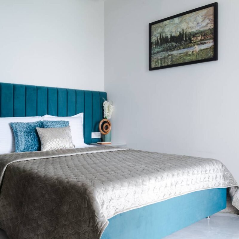 Modern Guest Bedroom Design With King Bed and Artwork