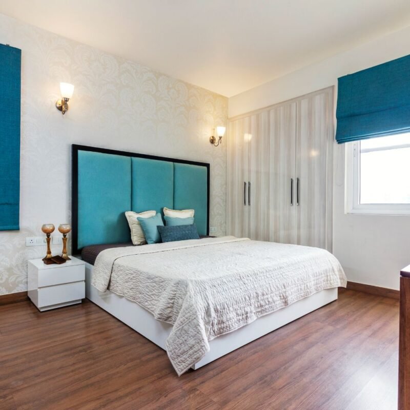 Modern 2BHK Flat Design with Blue Accents and Gold Highlights