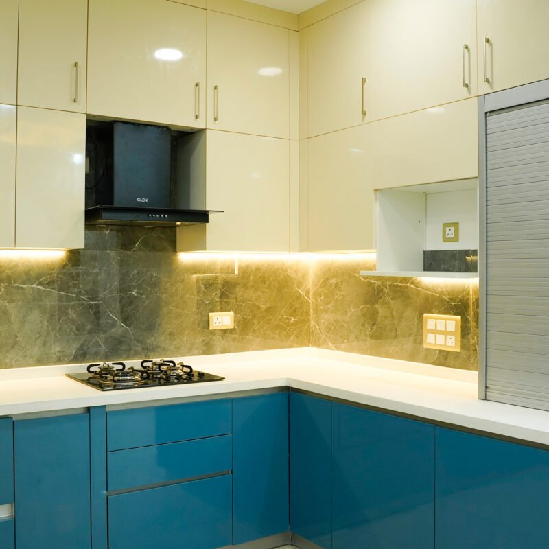 Contemporary L-Shaped Kitchen Design with Glossy Champagne Cabinets