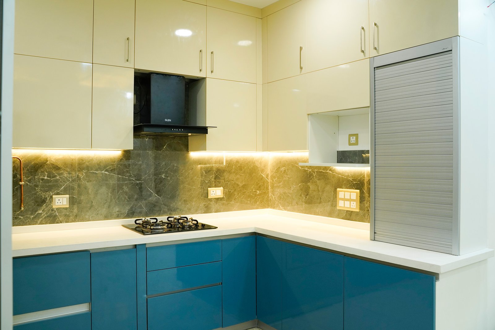 Contemporary L-Shaped Kitchen Design with Glossy Champagne Cabinets