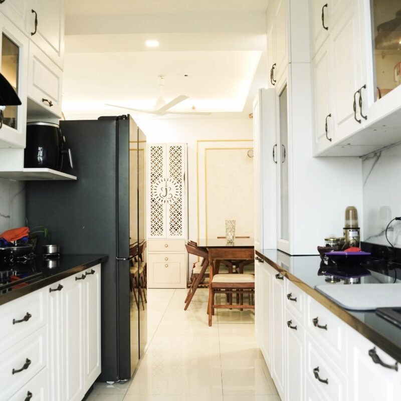 Classic Parallel Kitchen Design with Paneled Doors in Off White