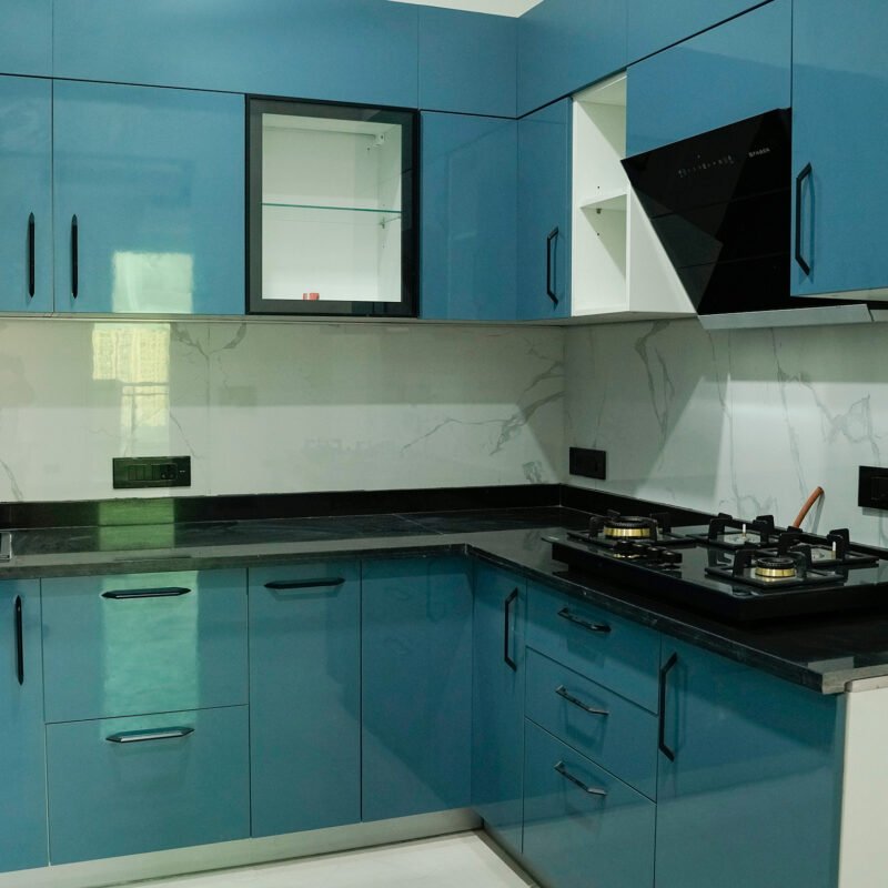 Modern Blue L-Shaped Kitchen Design with Glass Cabinets