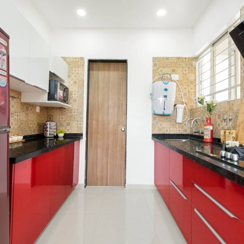 Contemporary 2BHK Flat Design with Motorcycle Wall Art and Parallel Kitchen