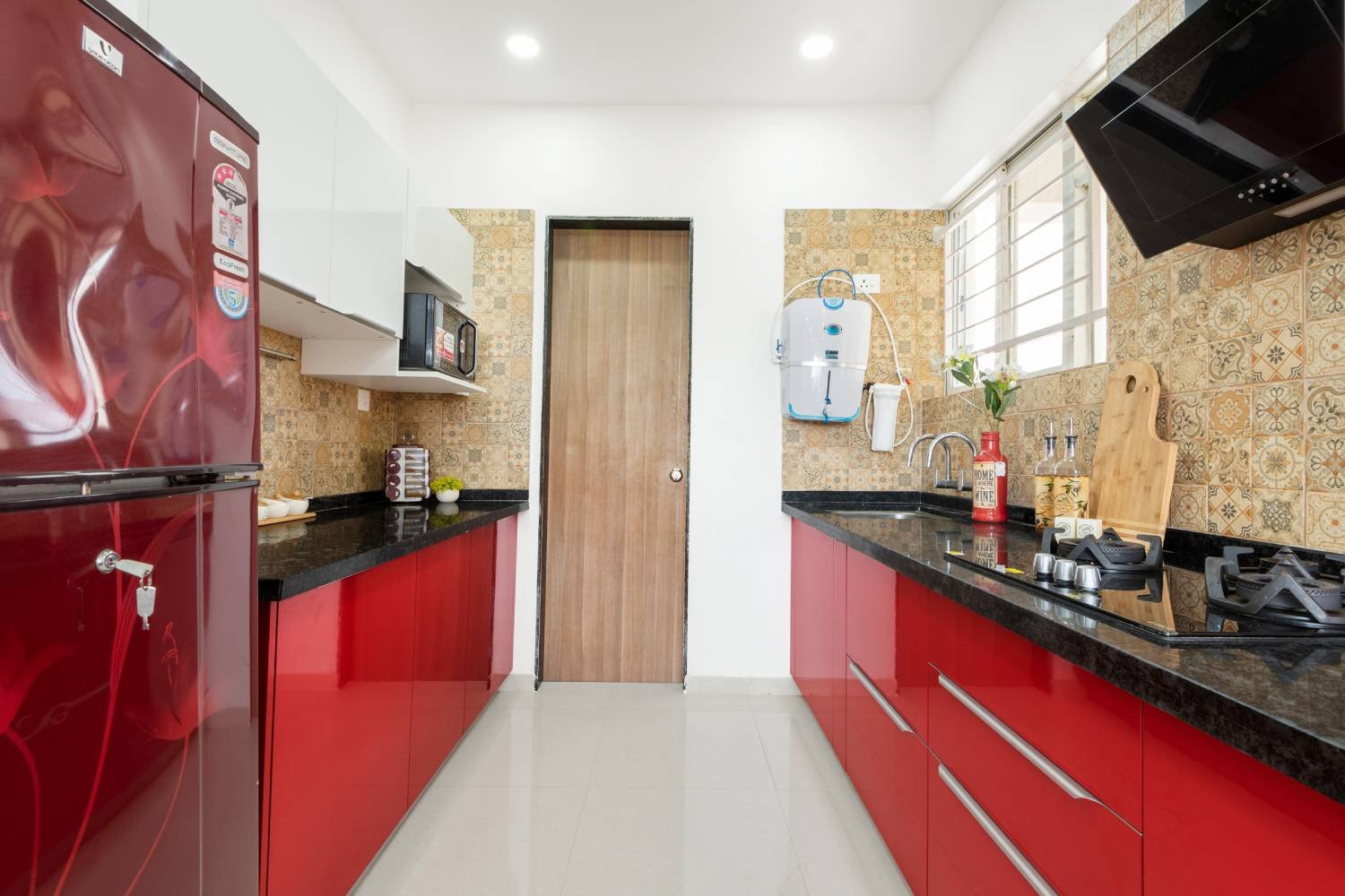 Contemporary 2BHK Flat Design with Motorcycle Wall Art and Parallel Kitchen
