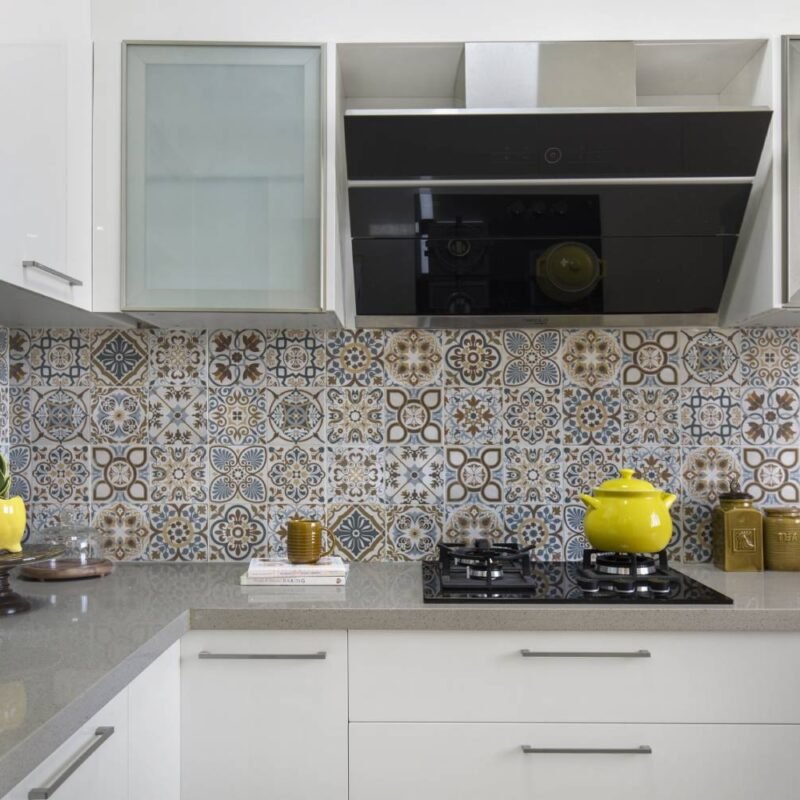 Contemporary 1BHK Flat Design with L-Shaped Kitchen and Stylish Dining Area