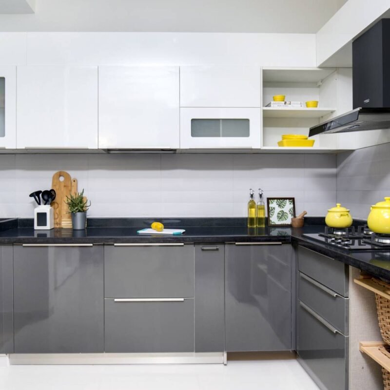 Inviting and Modern 2BHK Flat Design with L-Shaped Kitchen and Swing Wardrobes