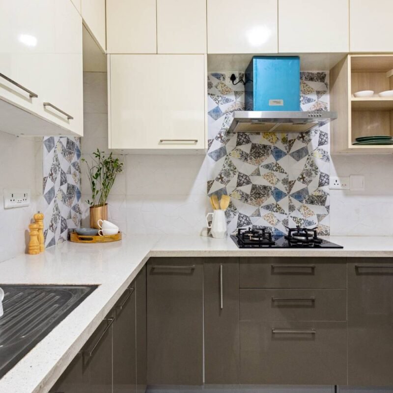 2BHK Modern Flat Design with L-Shaped Kitchen and Colorful Wardrobes