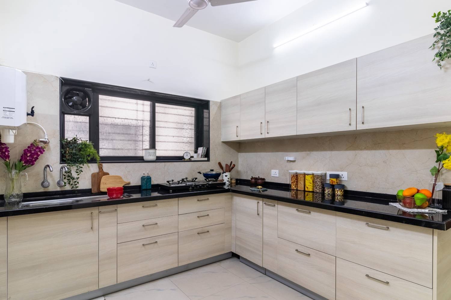 Contemporary 1BHK Flat Design with L-Shaped Kitchen and Swing Wardrobe