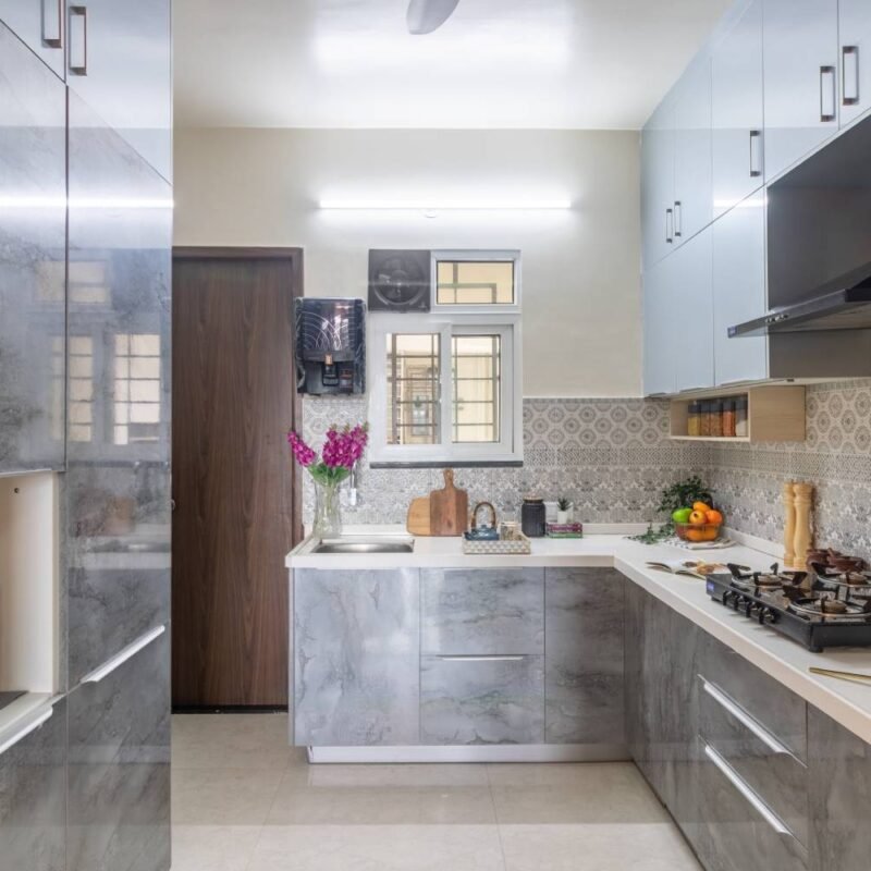 Contemporary 3BHK Flat Design with L-Shaped Kitchen and Stylish Wardrobes