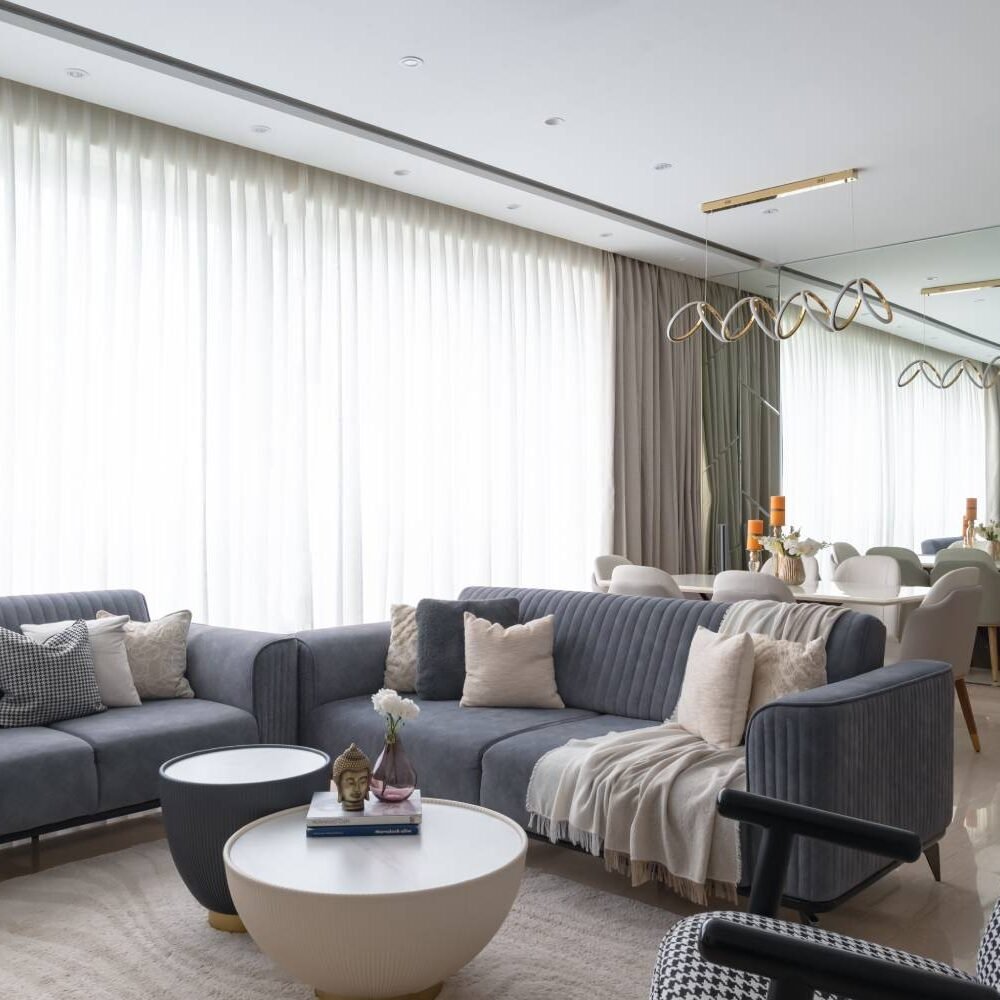 Modern Living Room Design with Blue Cushioned Seats and Round Table