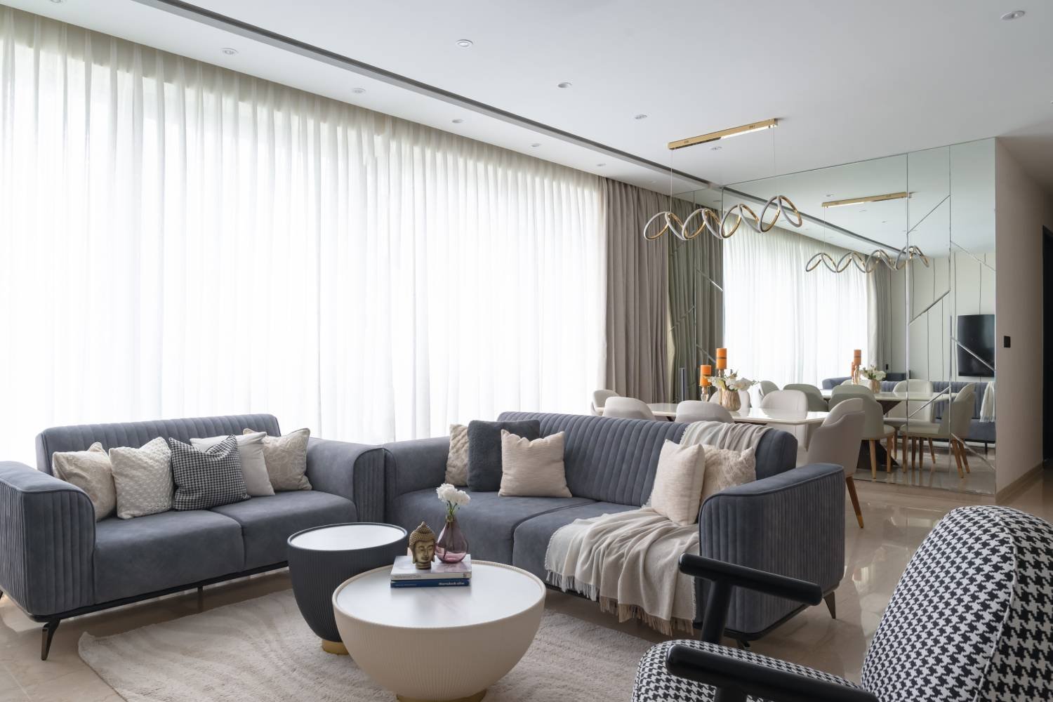 Modern Living Room Design with Blue Cushioned Seats and Round Table