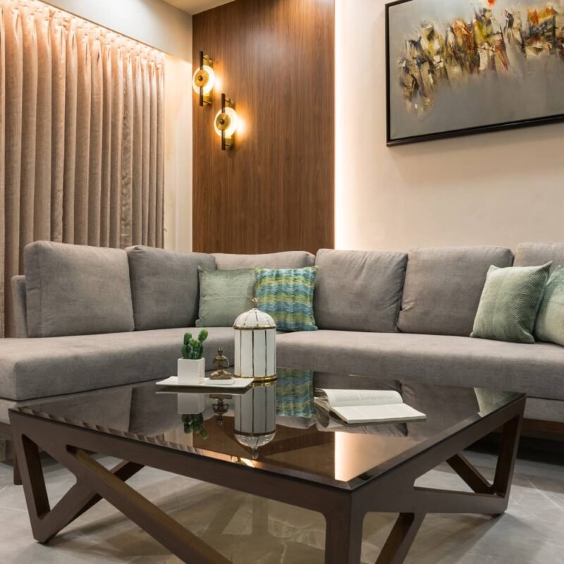 Contemporary Living Room Design with L-Shaped Grey Sofa and Glass Table