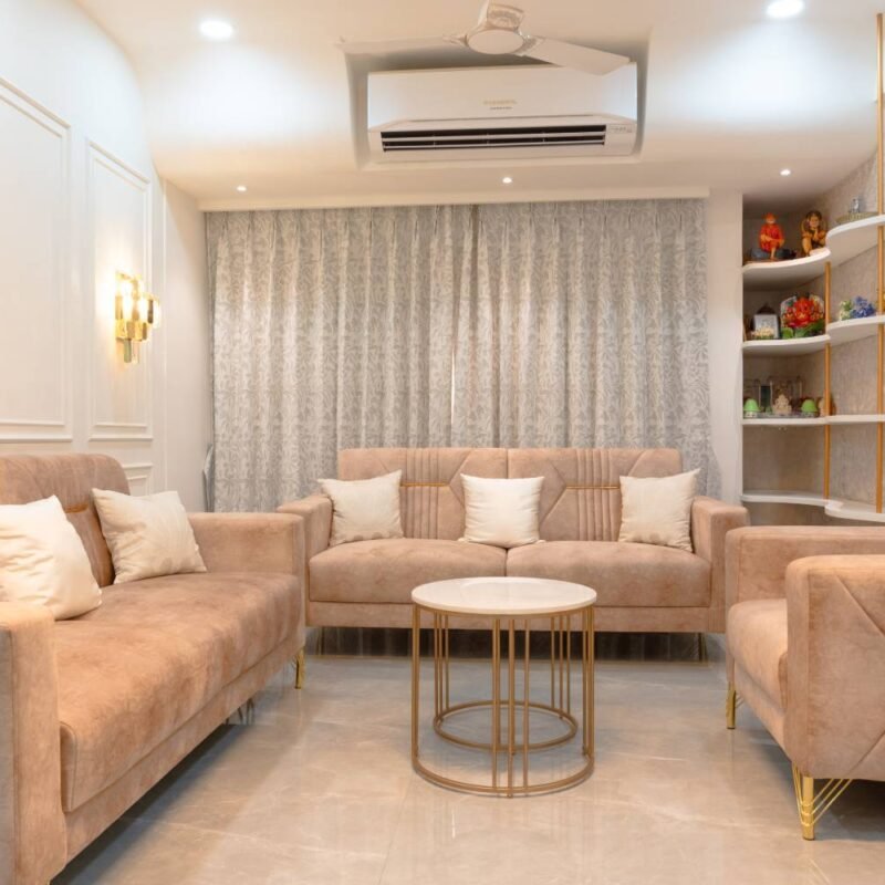 Contemporary Living Room Design with Beige Sofa and Round Marble Table