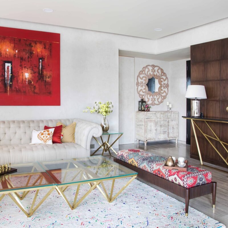 Minimal Glam Living Room With Beige Sofas and Artistic Wall Decor