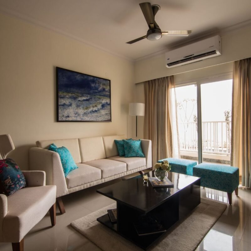 Modern 3BHK Flat Design with L-Shaped Kitchen and Rich Purple Accents