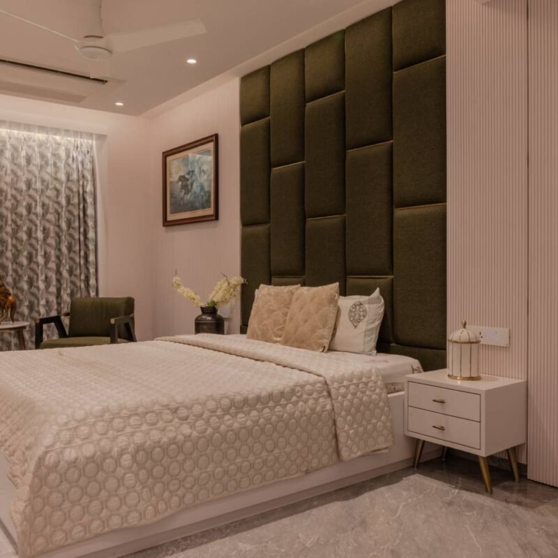 Modern Master Bedroom Design with Green Accent Chair and Round Table