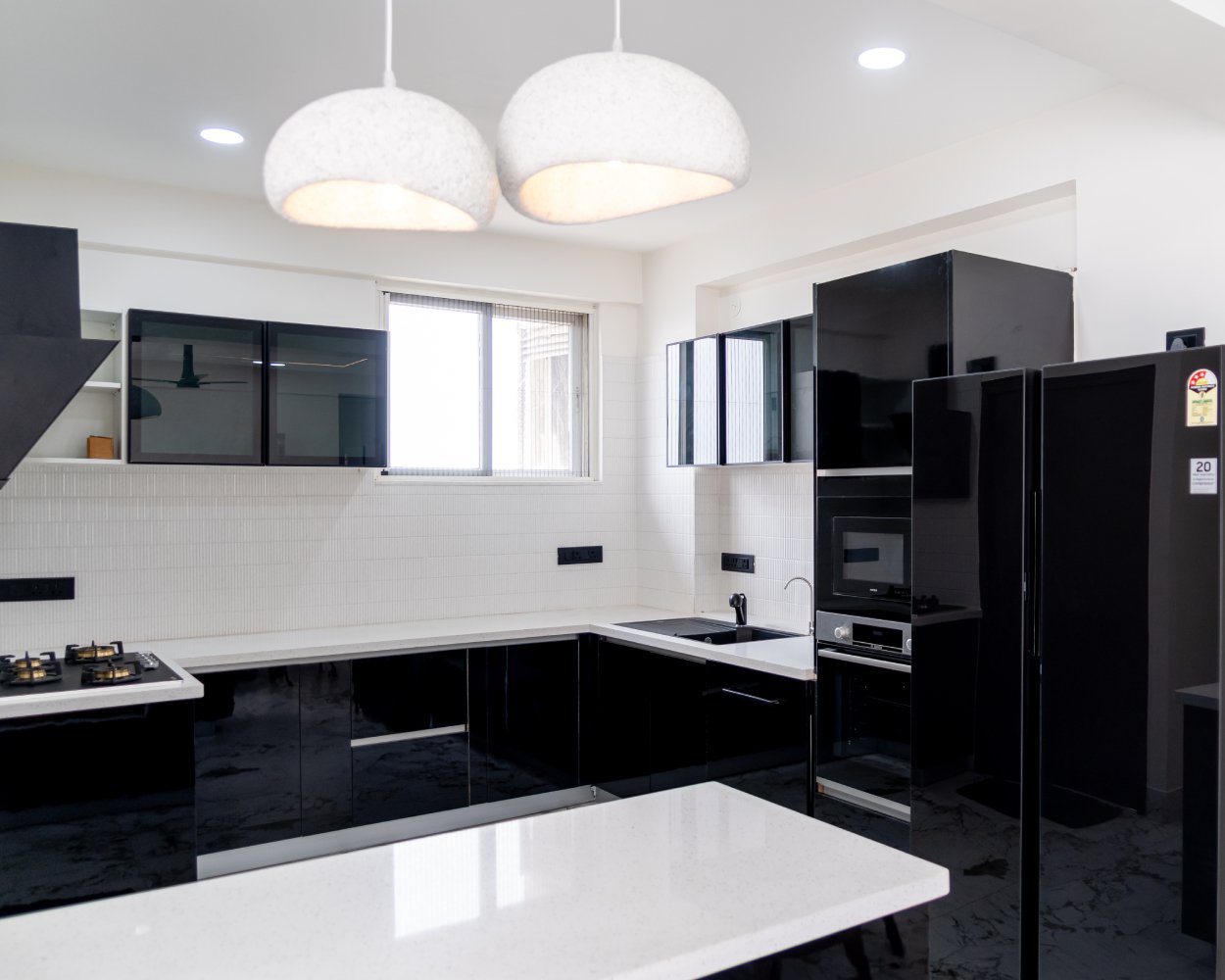 Modern Black Island Kitchen Design With Glossy Cabinets and Quartz Top